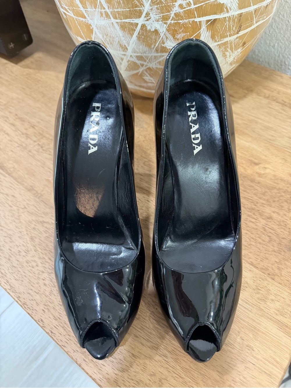 Prada Black Patent Leather Peep-Toe Heels
4 inch